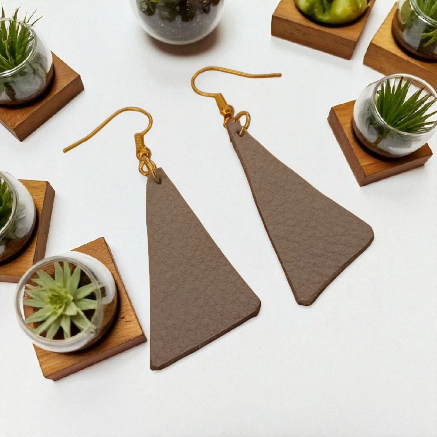 A-symetrical triangle veg tan leather earrings